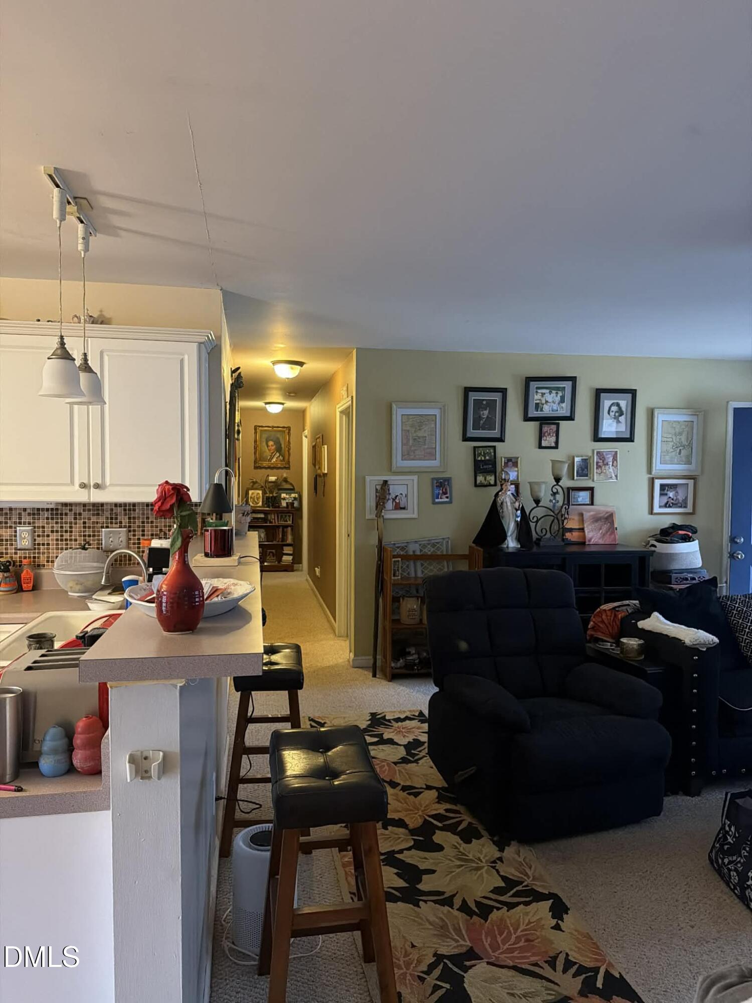 609 Shambley Road Mebane, NC 27302 - Photo 16 of 17 a living room with furniture and a flat screen tv