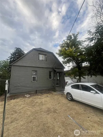 a house with trees in the background