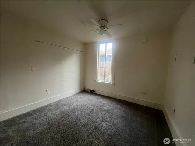 an empty room with a empty space and a window