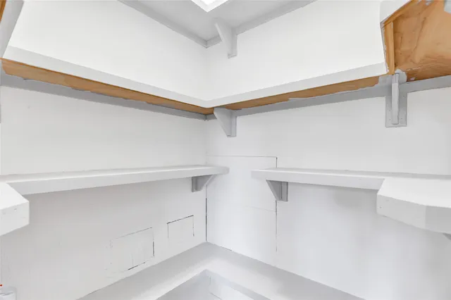 a view of an empty walk in closet