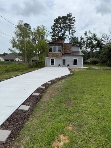 a front view of a house with garden