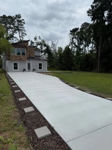 an arial view of a house with a yard