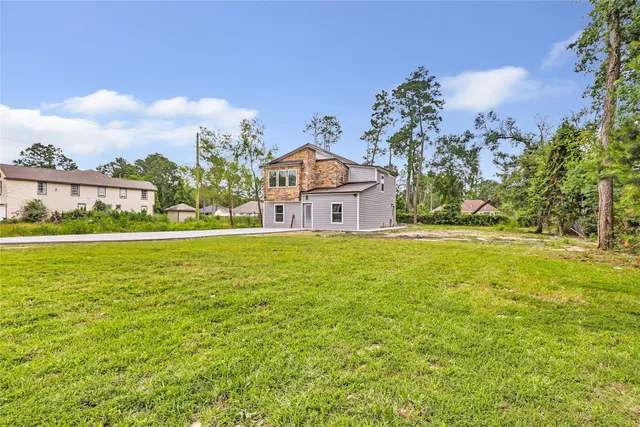 a house view with swimming pool in front of it