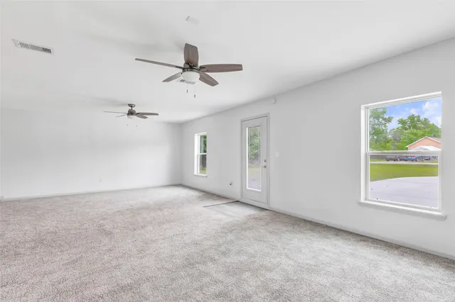 a view of an empty room with a window