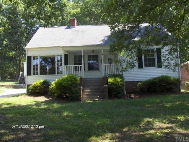 241 Wesleyan Heights Road Roxboro, NC 27573 - Photo 1 of 1 a front view of a house with garden