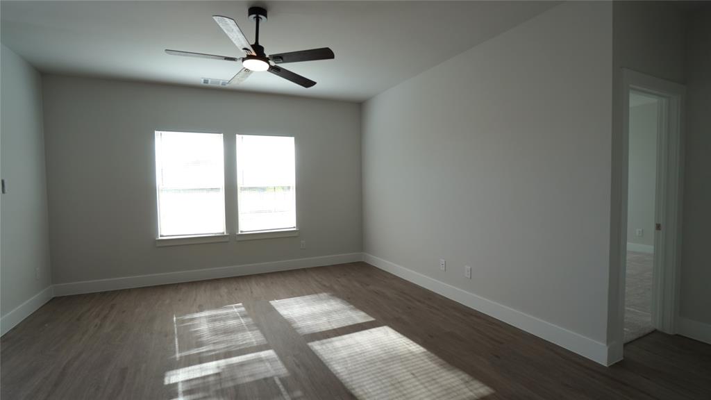 1374 Chisos Way Forney, TX 75126 - Photo 6 of 25 wooden floor in an empty room with a window