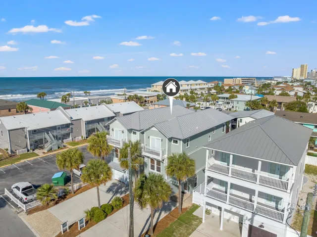 an aerial view of residential houses with outdoor space