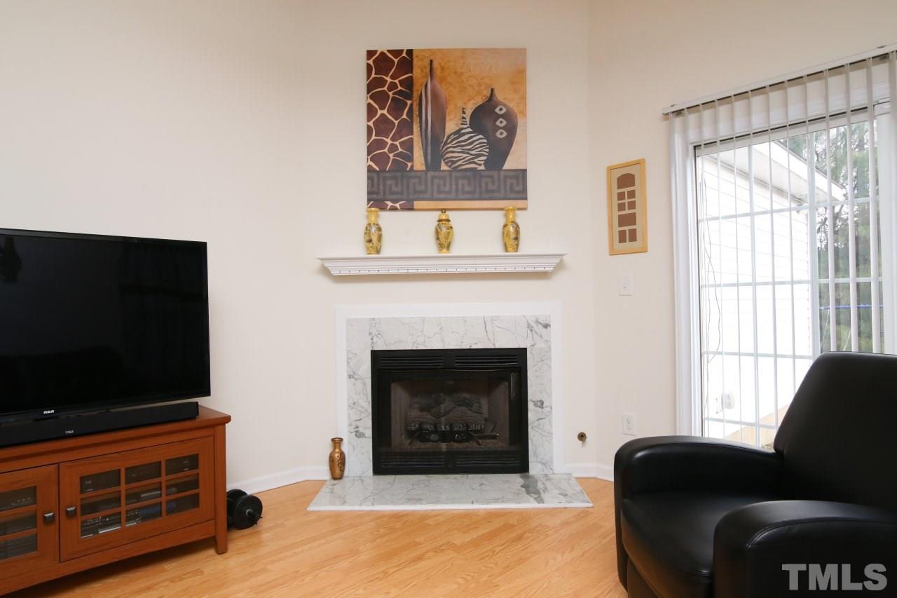 4725 Silverdene Street Raleigh, NC 27616 - Photo 11 of 25 Fireplace in family room