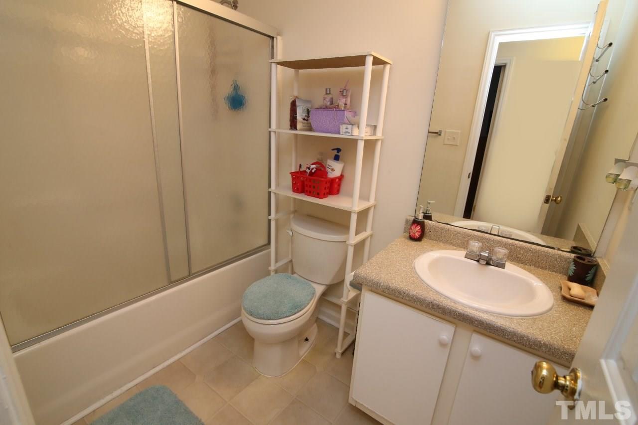 4725 Silverdene Street Raleigh, NC 27616 - Photo 22 of 25 Hall bath with new glass doors