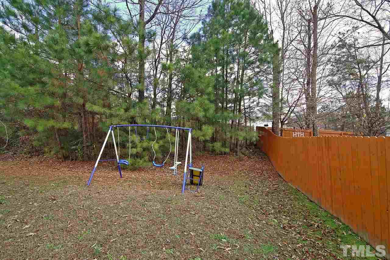 4725 Silverdene Street Raleigh, NC 27616 - Photo 24 of 25 Backyard & swing set conveys