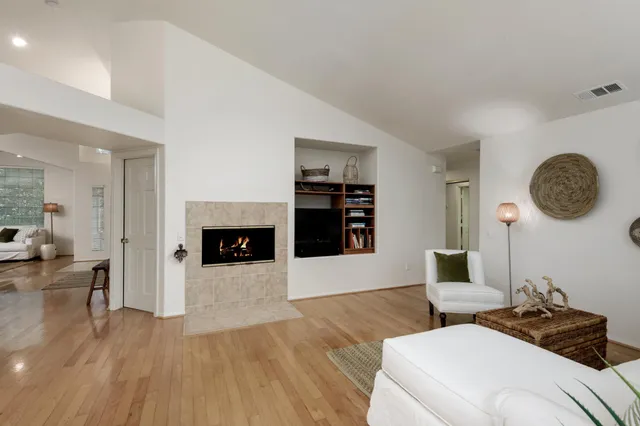 a living room with couches and a fireplace
