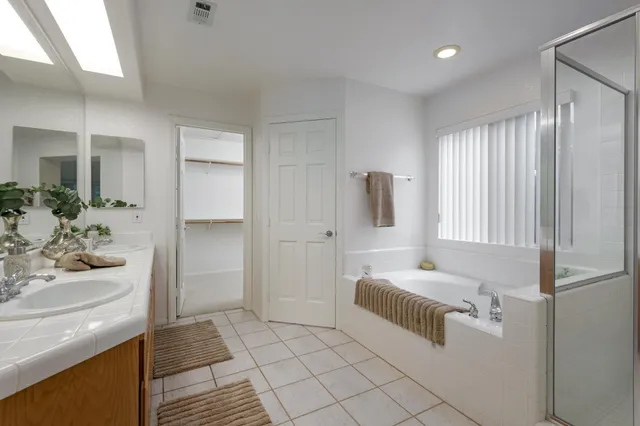 a bathroom with a bathtub and a sink