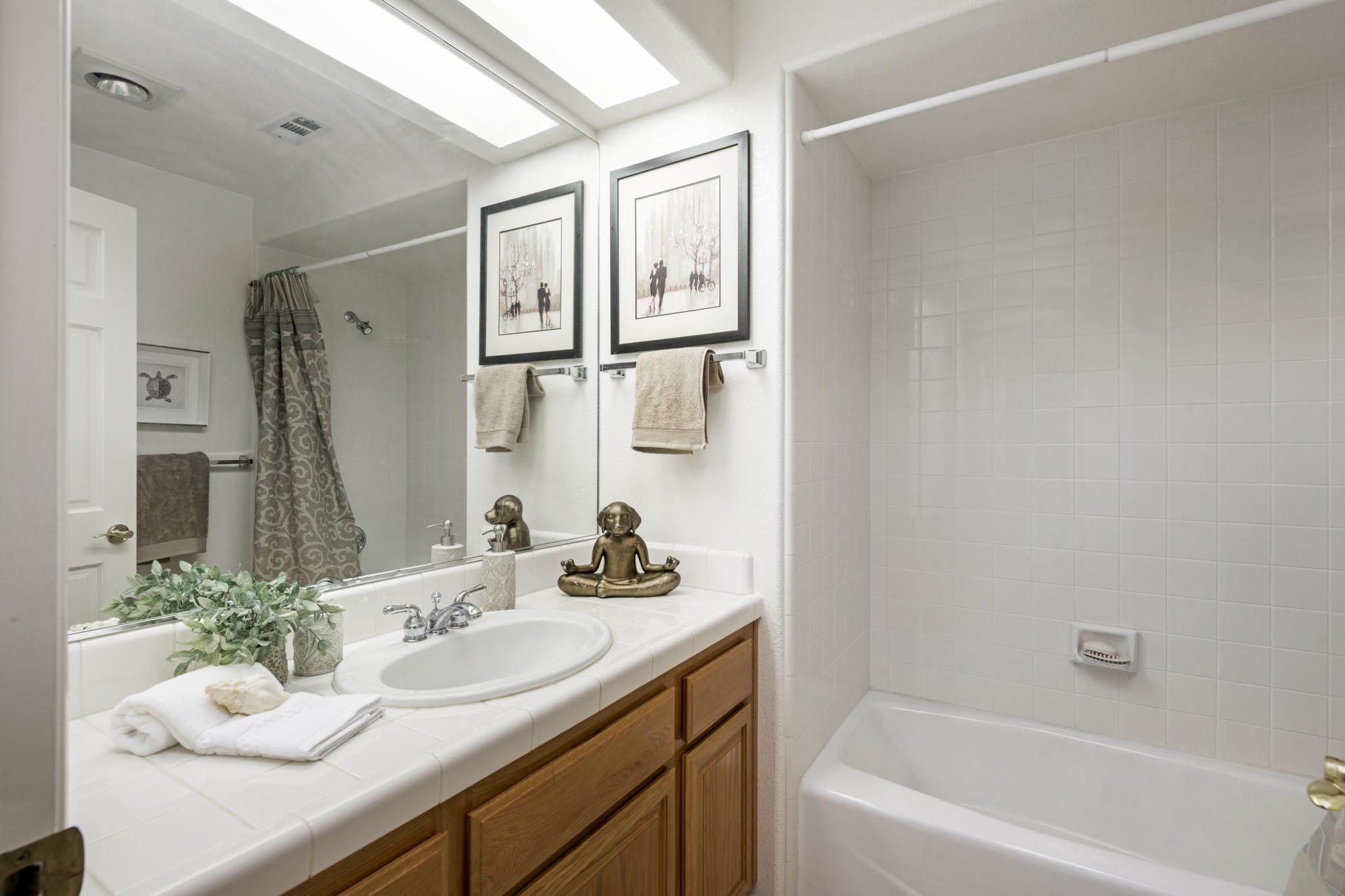 3715 Hitchcock Ranch Road Santa Barbara, CA 93105 - Photo 22 of 36 a bathroom with a granite countertop sink mirror and a bath tub