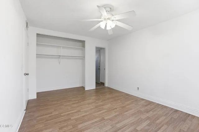 a view of an empty room with a fan