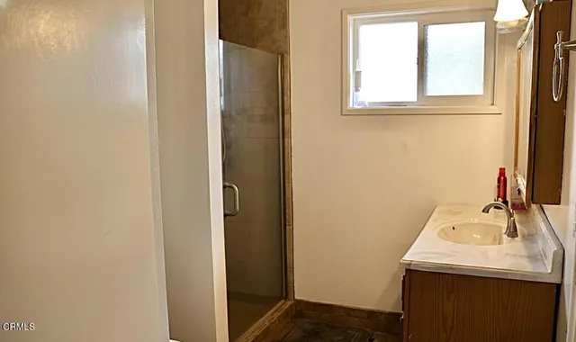 a bathroom with a sink and a window