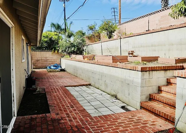 a view of a balcony with potted plants