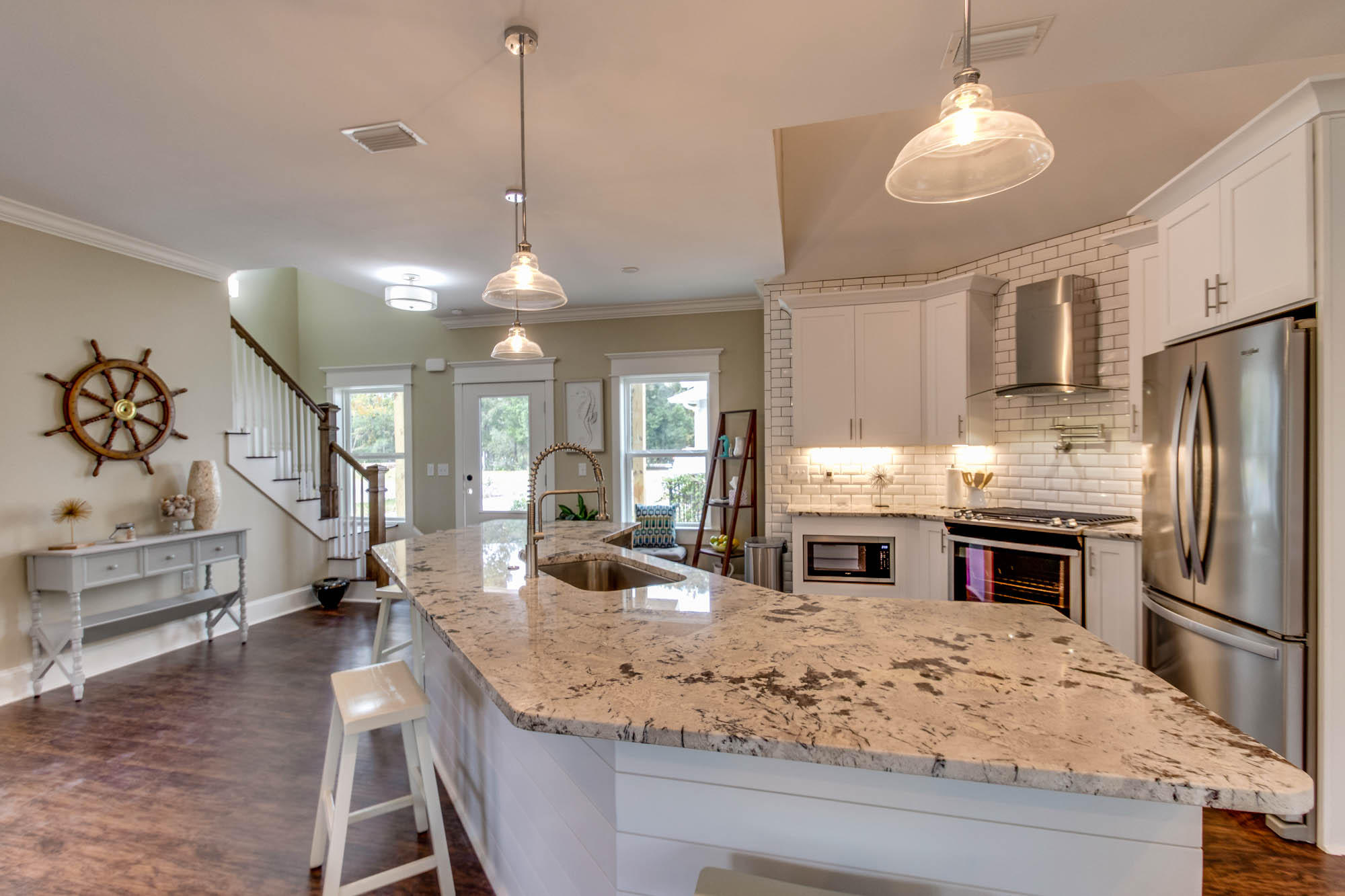 148 Rearden Way Santa Rosa Beach, FL 32459 - Photo 12 of 43 a kitchen with stainless steel appliances granite countertop a sink refrigerator and cabinets