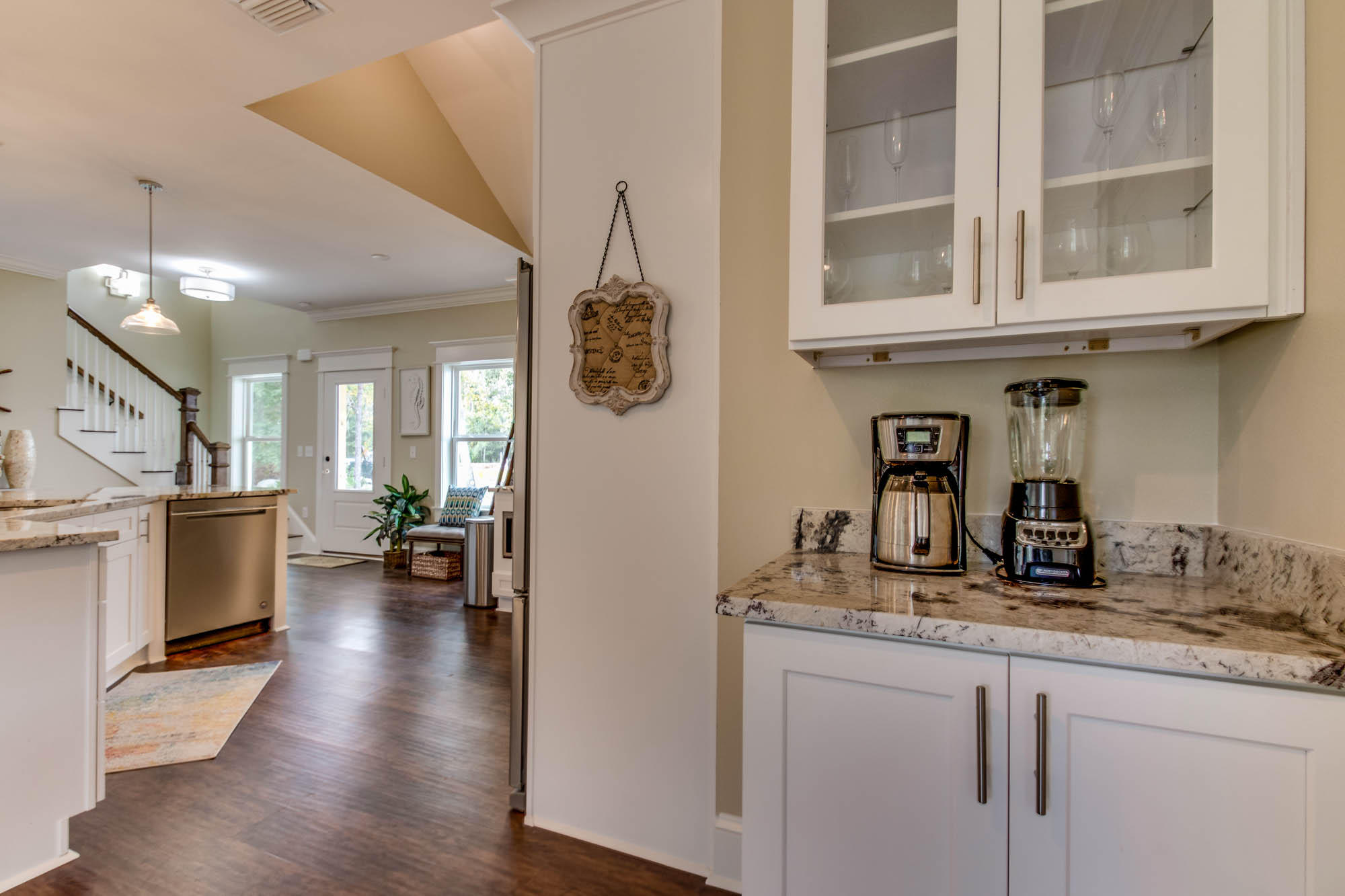 148 Rearden Way Santa Rosa Beach, FL 32459 - Photo 13 of 43 a kitchen with stainless steel appliances granite countertop a refrigerator a stove and a wooden floors