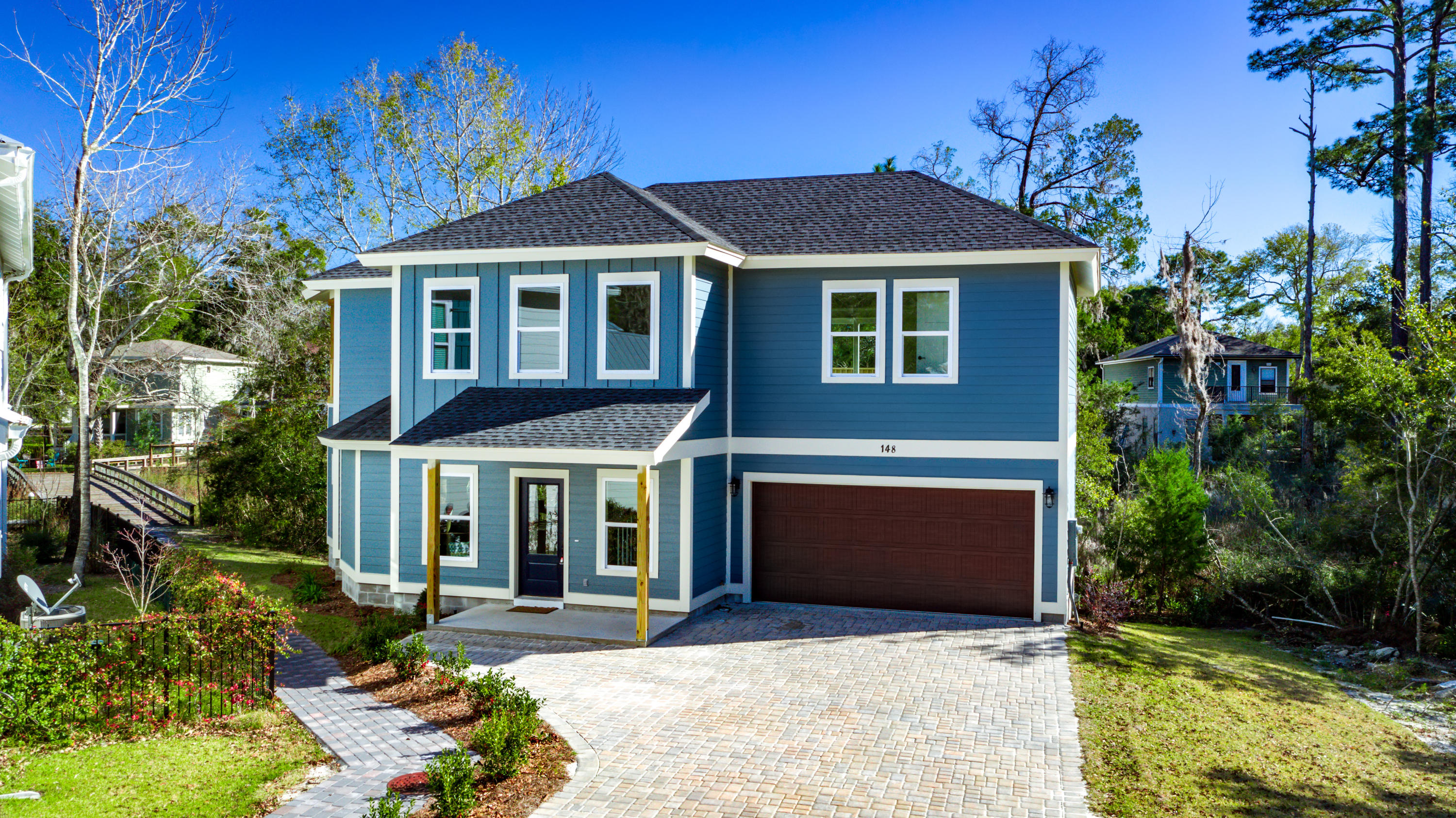148 Rearden Way Santa Rosa Beach, FL 32459 - Photo 2 of 43 a front view of a house with garden