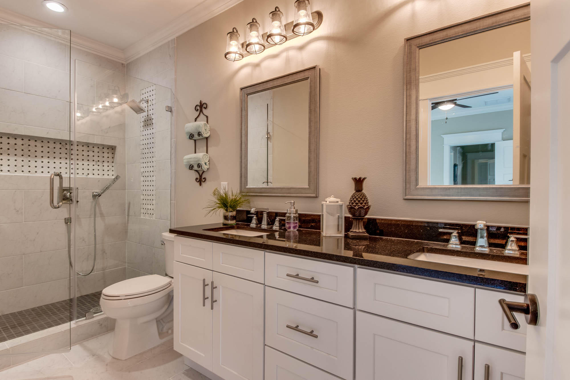 148 Rearden Way Santa Rosa Beach, FL 32459 - Photo 25 of 43 a bathroom with a double vanity sink toilet mirror and shower
