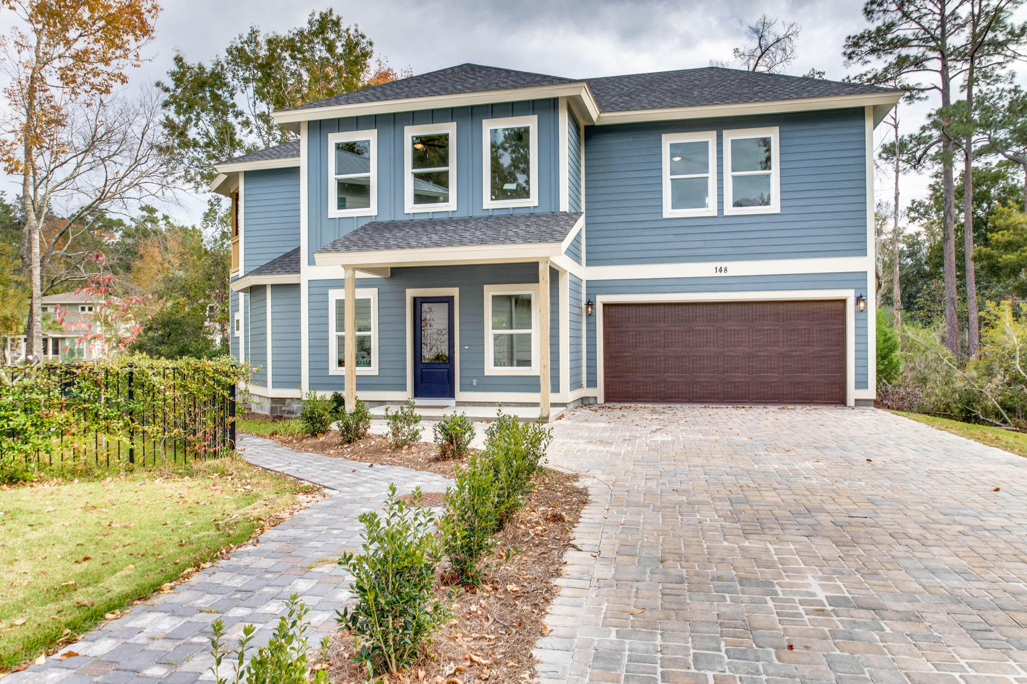 148 Rearden Way Santa Rosa Beach, FL 32459 - Photo 3 of 43 a front view of a house with a yard and garage