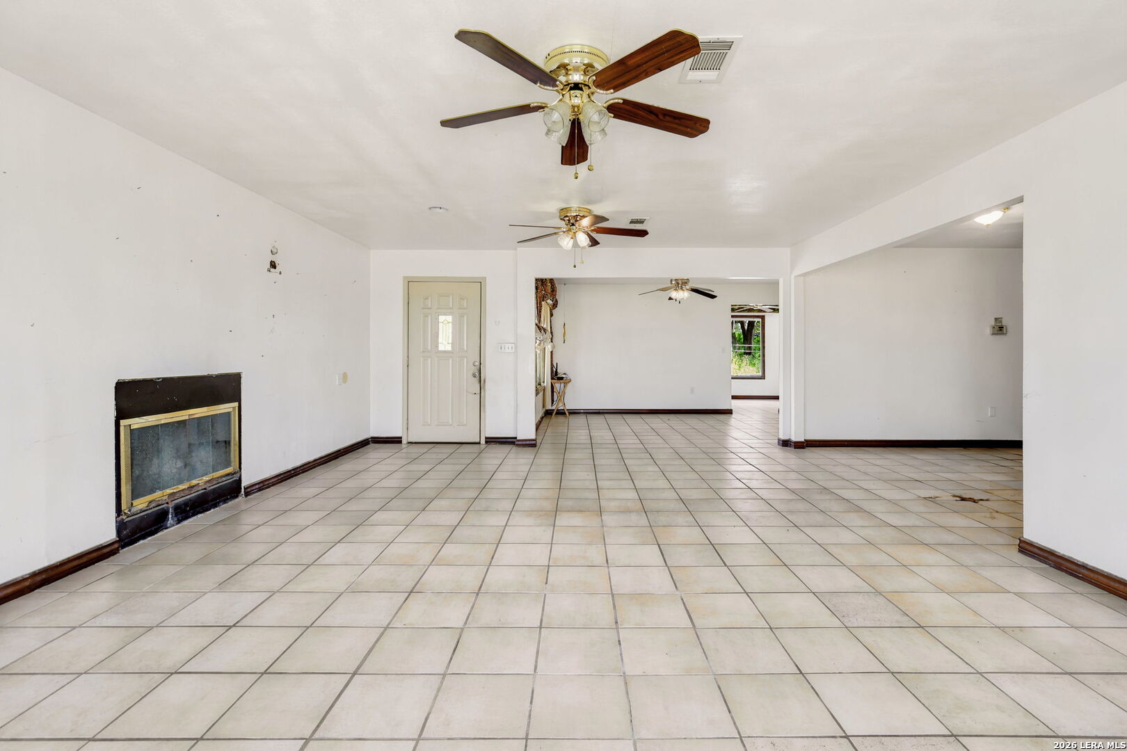 3061 Horse Ranch Road San Antonio, TX 78264 - Photo 6 of 34 a view of empty room with cabinet and fan