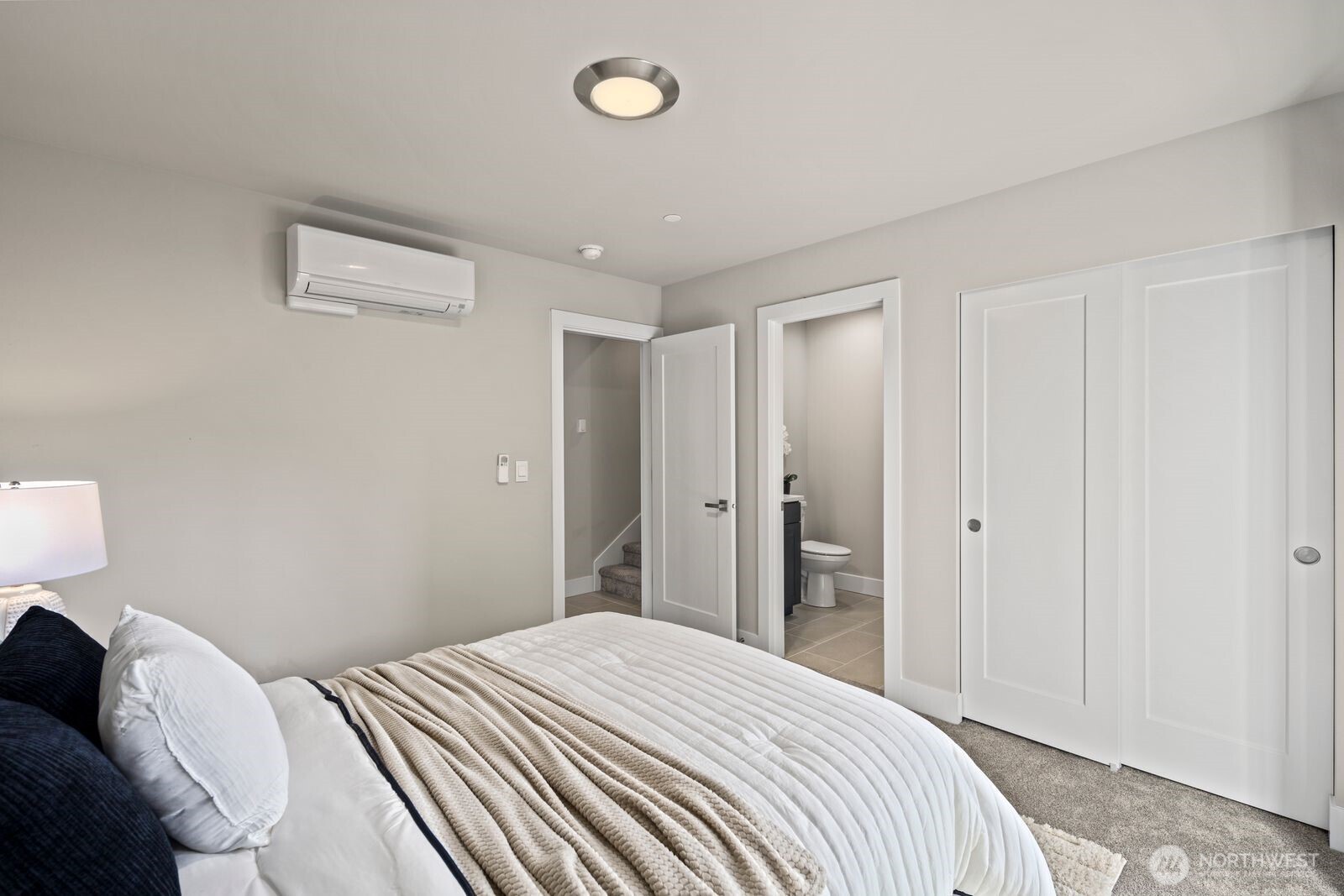 826 238th Place Southeast, Unit F Bothell, WA 98021 - Photo 17 of 39 a bedroom with a bed and bathroom