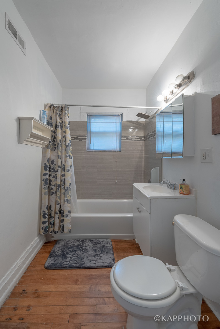 217 Des Plaines Avenue, Unit 1 Forest Park, IL 60130 - Photo 11 of 15 a bathroom with a toilet and shower