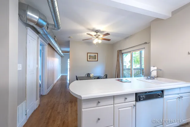 a bathroom with a sink a chandelier and a mirror