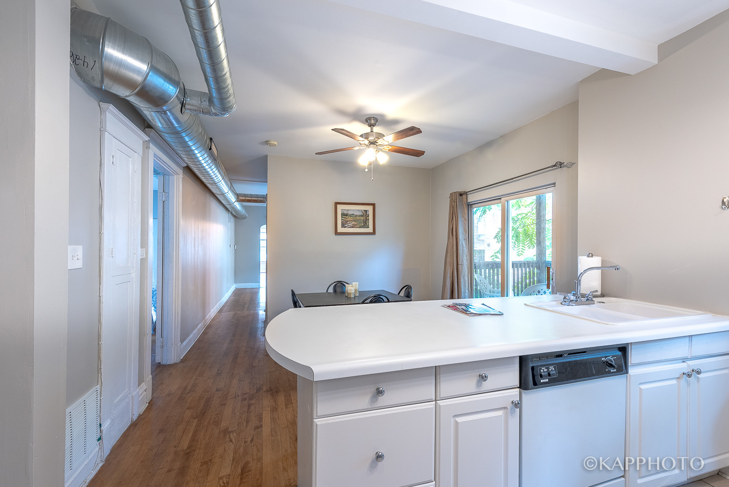 217 Des Plaines Avenue, Unit 1 Forest Park, IL 60130 - Photo 7 of 15 a bathroom with a sink a chandelier and a mirror