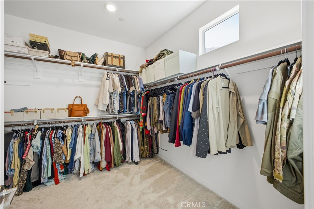 32736 Brunello Way Temecula, CA 92591 - Photo 27 of 75 a view of walk in closet with clothes and shoes