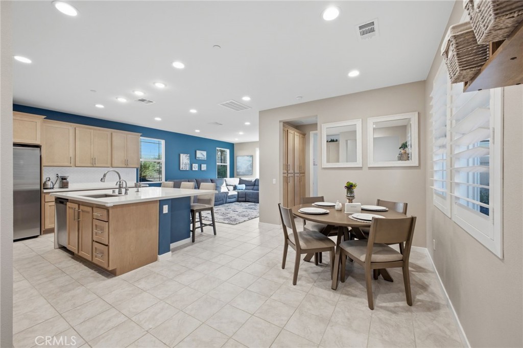 32736 Brunello Way Temecula, CA 92591 - Photo 34 of 75 a kitchen with a table and chairs in it