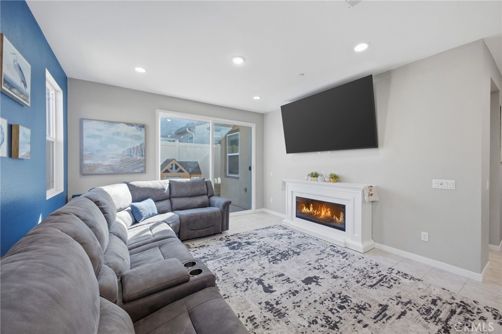 32736 Brunello Way Temecula, CA 92591 - Photo 46 of 75 a living room with furniture and a flat screen tv