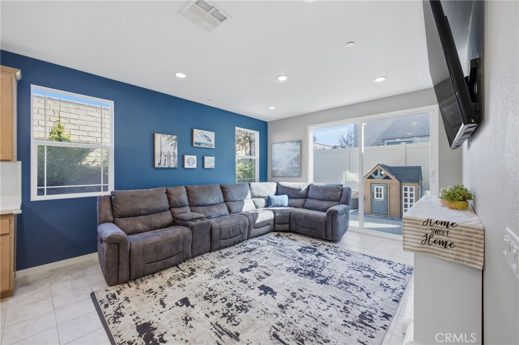 32736 Brunello Way Temecula, CA 92591 - Photo 47 of 75 a living room with furniture and a flat screen tv