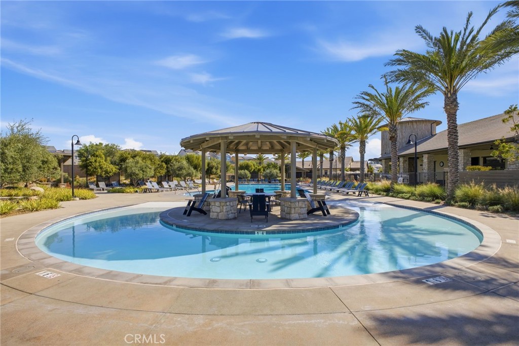 32736 Brunello Way Temecula, CA 92591 - Photo 63 of 75 a view of a swimming pool with chairs