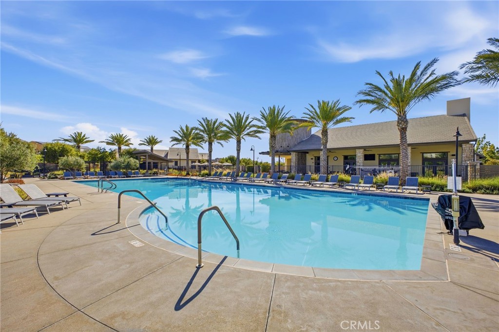 32736 Brunello Way Temecula, CA 92591 - Photo 64 of 75 a swimming pool with outdoor seating and yard
