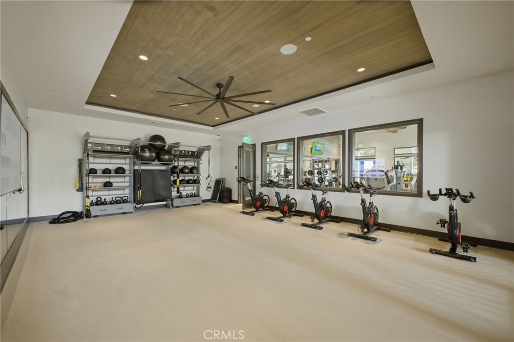 32736 Brunello Way Temecula, CA 92591 - Photo 66 of 75 a view of a livingroom with gym equipment and a large window