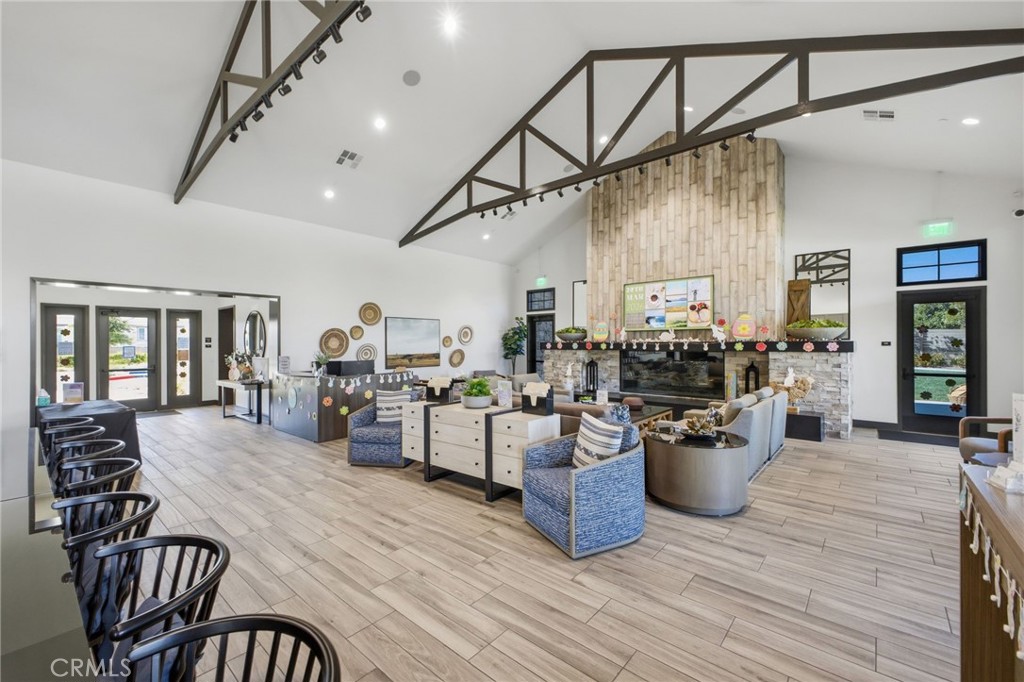 32736 Brunello Way Temecula, CA 92591 - Photo 67 of 75 a view of a dining room with furniture window and wooden floor