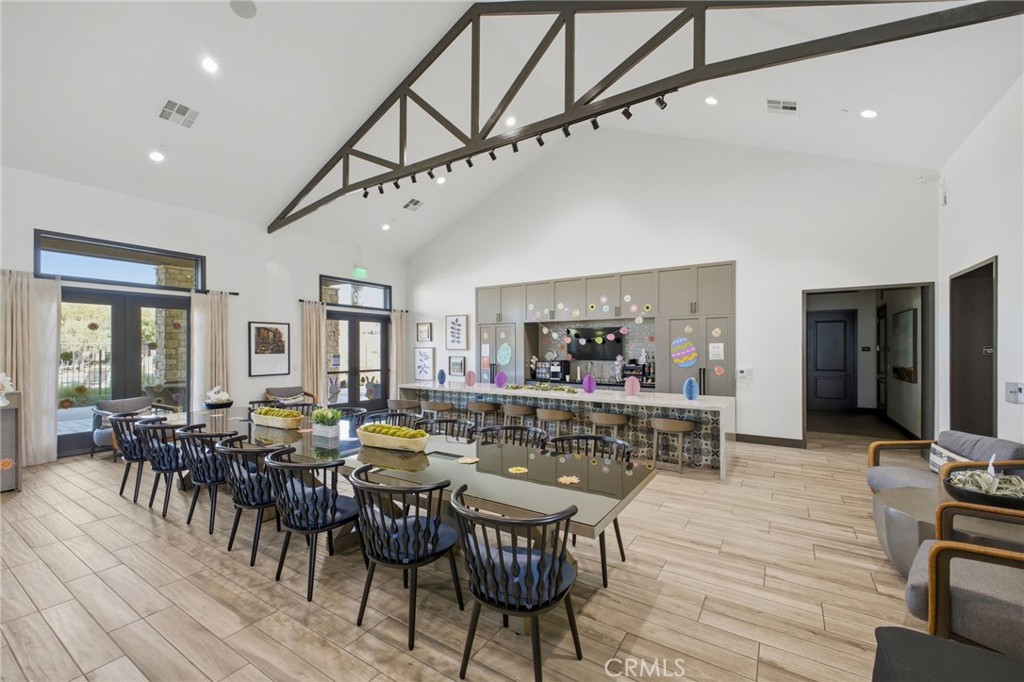 32736 Brunello Way Temecula, CA 92591 - Photo 68 of 75 a view of a dining room with furniture window and wooden floor