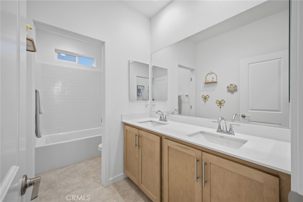 32736 Brunello Way Temecula, CA 92591 - Photo 9 of 75 a bathroom with a sink a toilet and shower