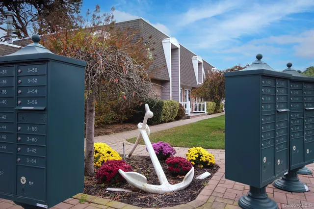 a view of a house with a tub and a yard