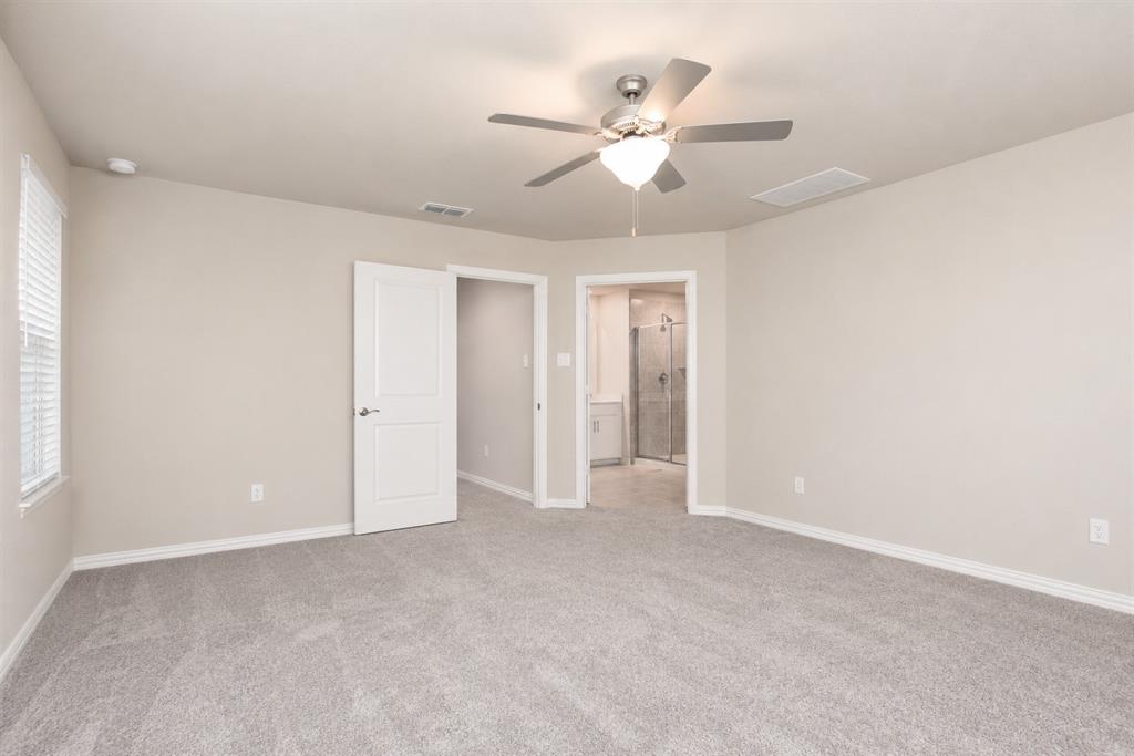 3704 Banton Street Rowlett, TX 75089 - Photo 14 of 16 Spacious room featuring light gray carpet flooring, neutral painted walls, and a ceiling fan with integrated lighting