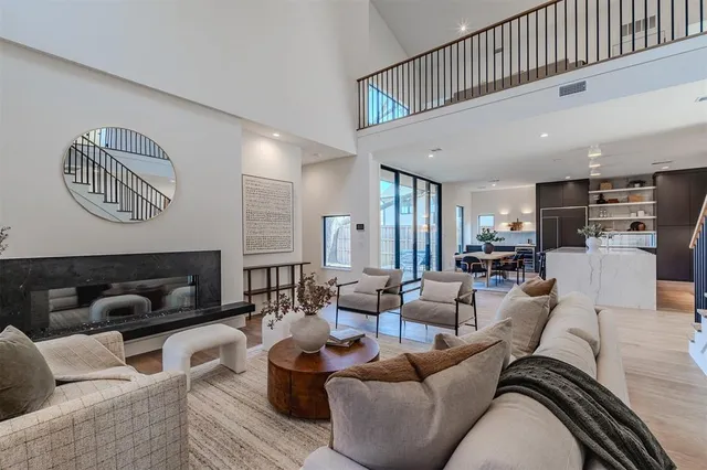a living room with furniture and kitchen view