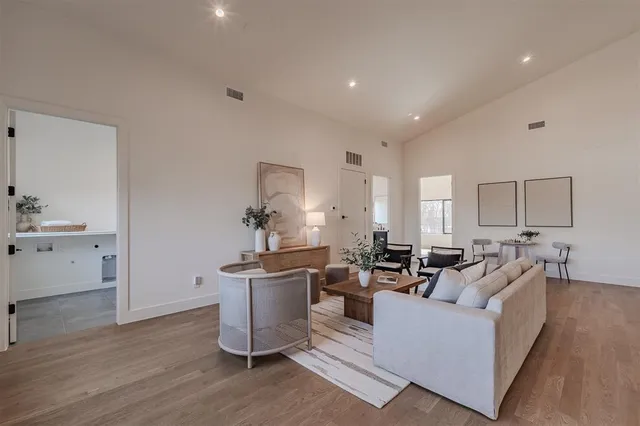 a living room with furniture or wooden floor and a chandelier