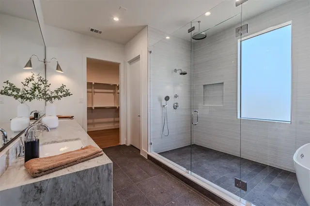 a bathroom with a sink and shower