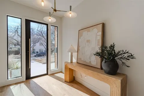 a view of living room filled with furniture and a potted plant