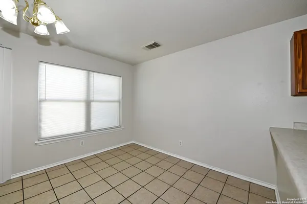 a view of a room that has a window in it