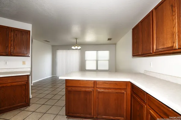 a kitchen with stainless steel appliances granite countertop a sink dishwasher stove and cabinets
