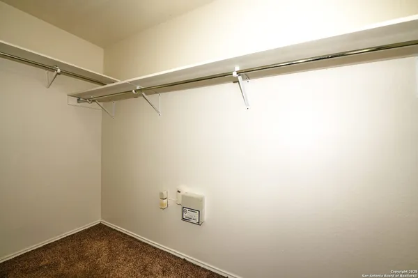 a view of a room with racks on the wall