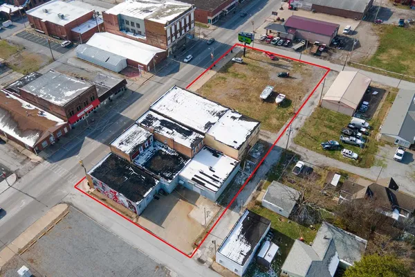 an aerial view of residential house with outdoor space